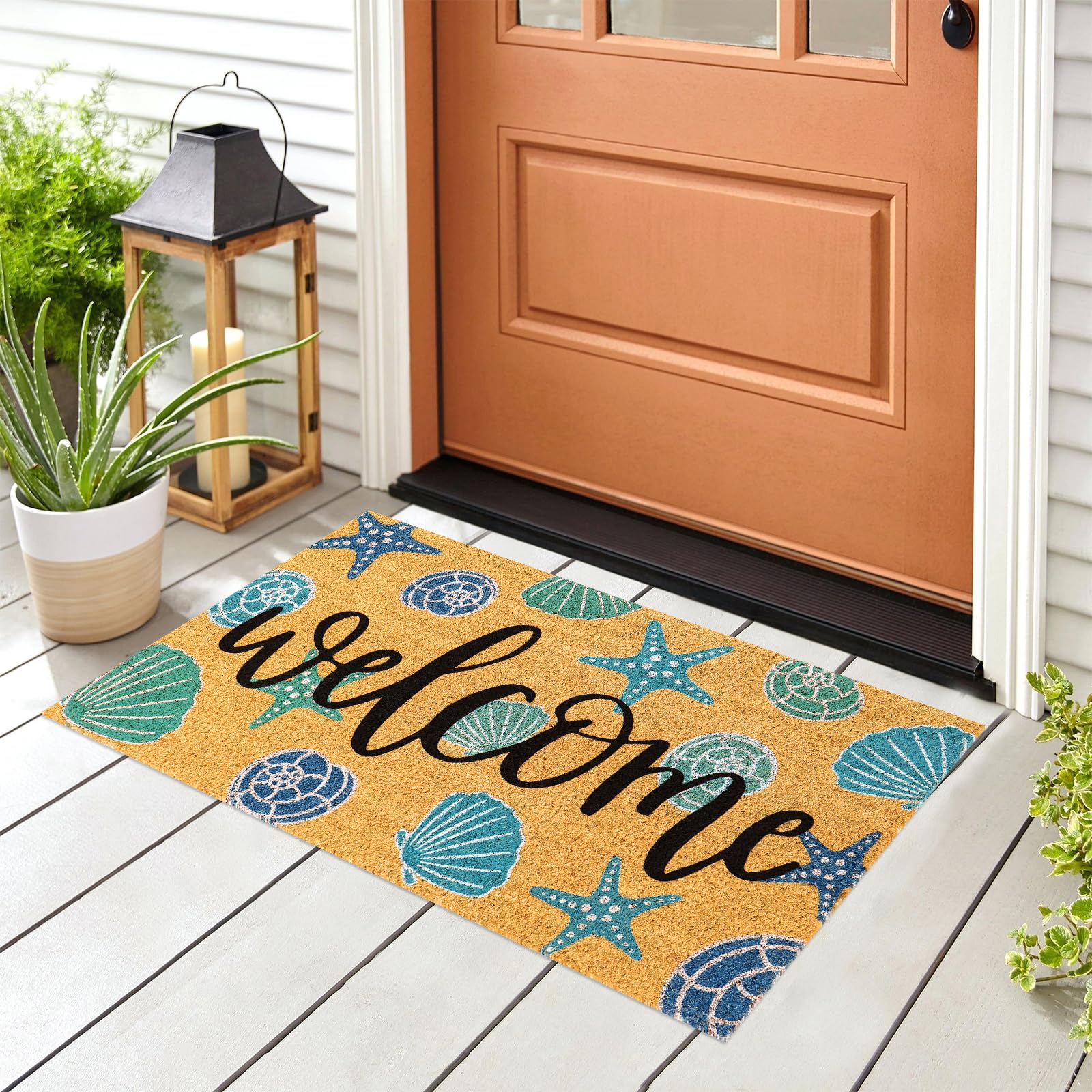 JarThenaAMCS starfish seashell door mat adds coastal charm to the entry
