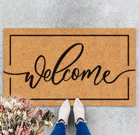 JarThenaAMCS Welcome Mat in natural coir with rustic brown tone traps dirt at entry.