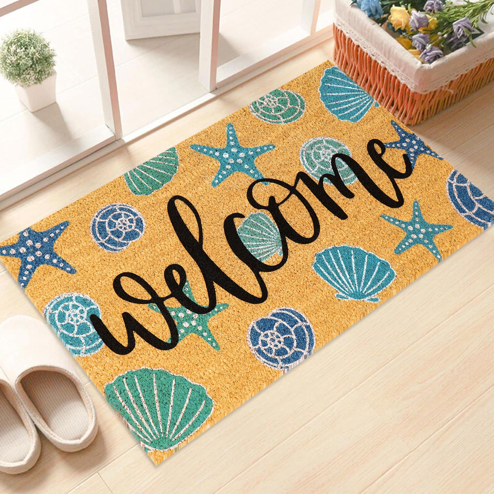 JarThenaAMCS welcome seashell design door mat with conch motif at entry