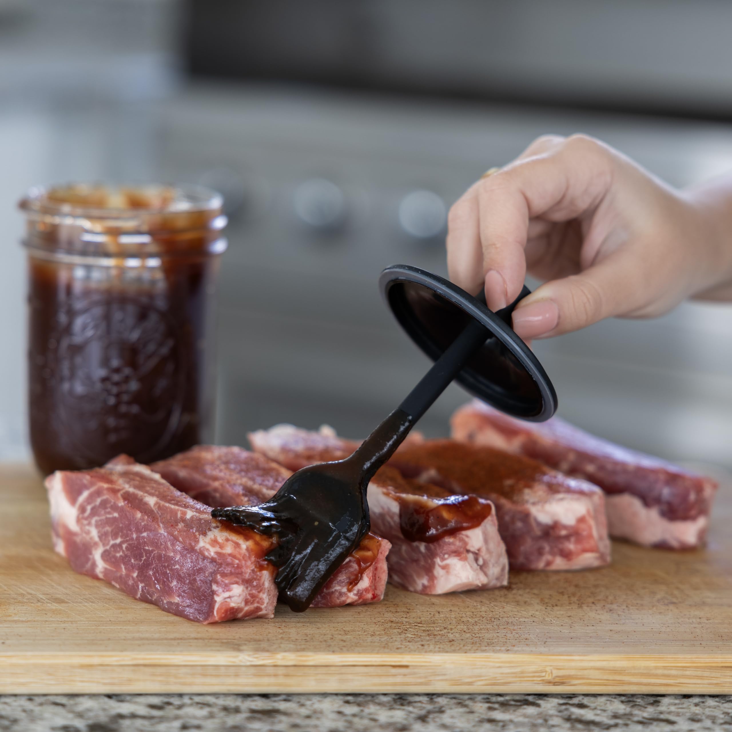 Dishwasher-safe Jarware silicone lid showcasing easy cleaning and reuse.