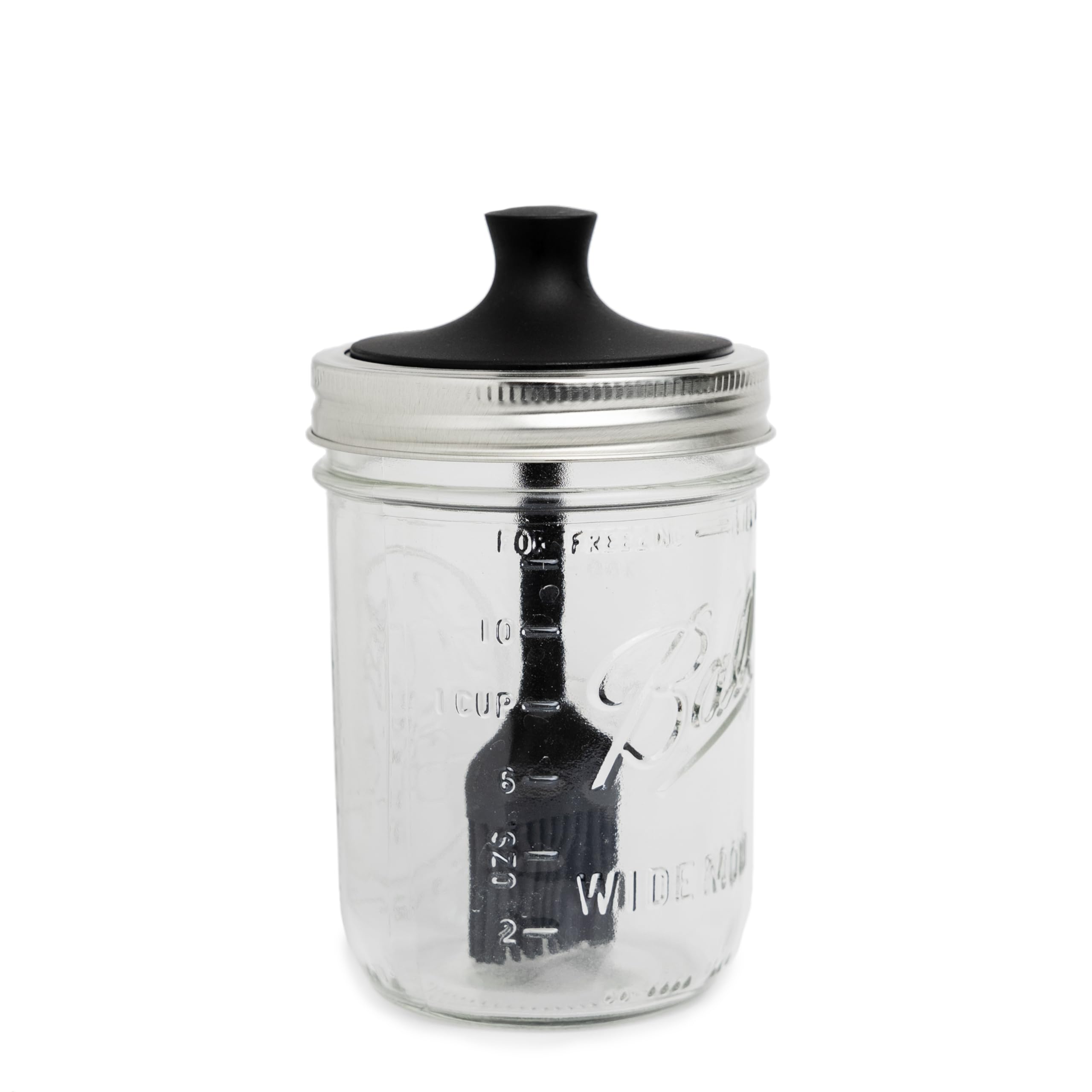 Jarware silicone black basting brush lid on a wide mouth jar for smooth sauce application.