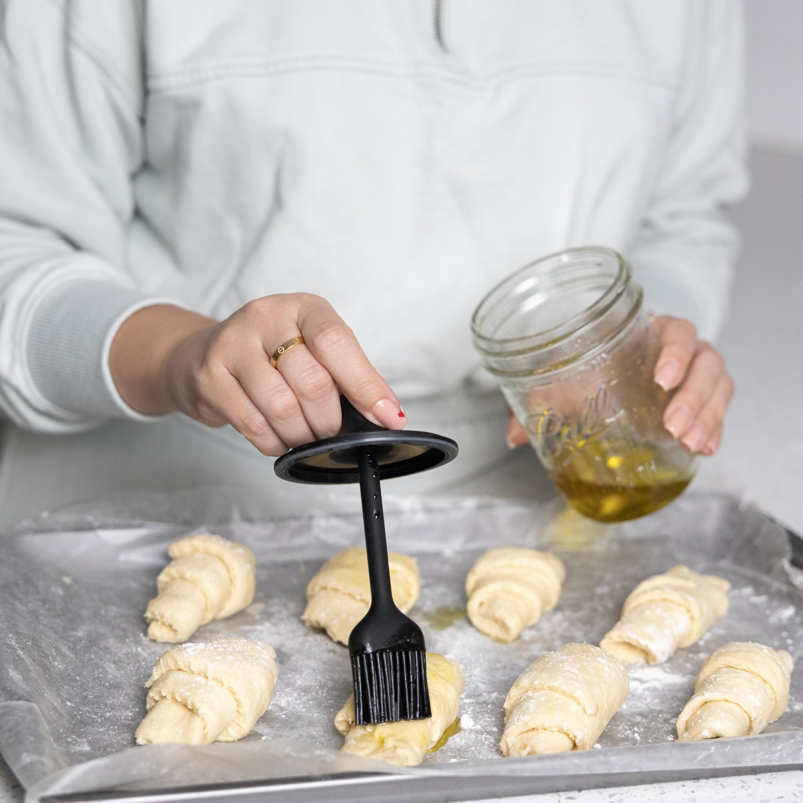 Jarware lid highlights soft silicone bristles ideal for brushing sauces and oils.