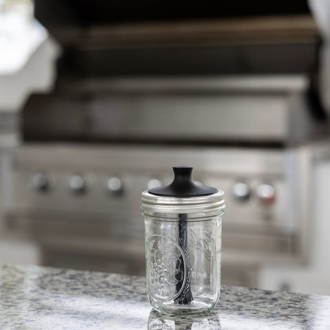 Jarware wide mouth jar lid with silicone bristles spreading marinades evenly.