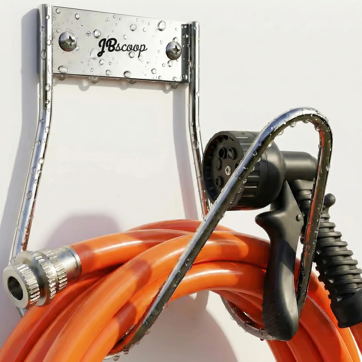 JBscoop garden hose holder mounted on wall keeps hoses tidy and ready.