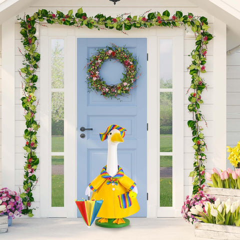 JcHrmers GANSHAYA yellow duck accent brings whimsy to a garden display.
