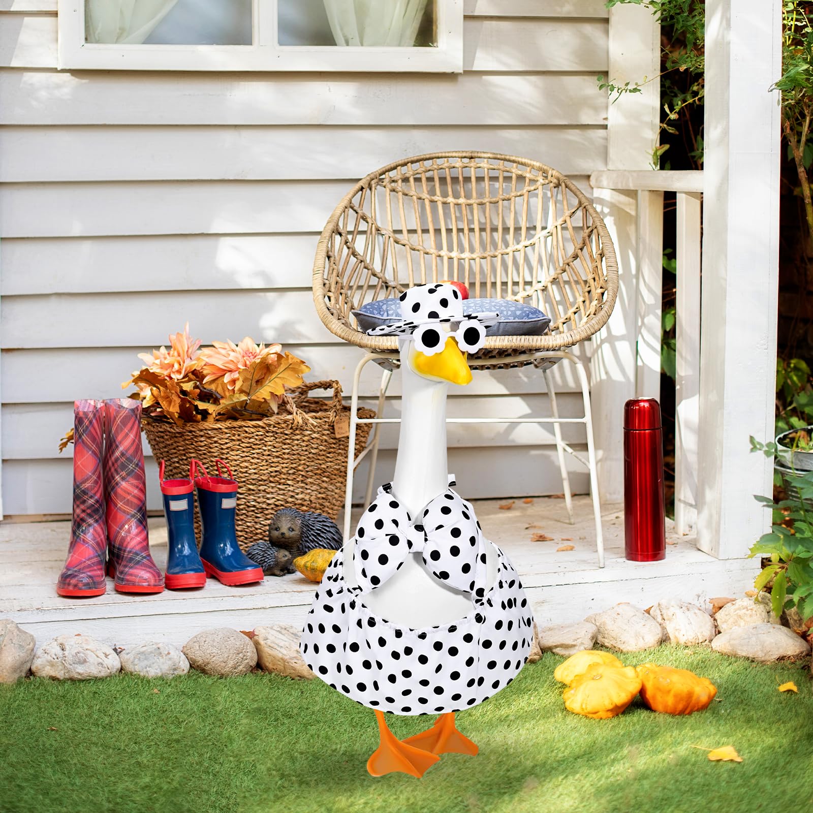 JcHrmers garden-scene display with colorful goose outfit