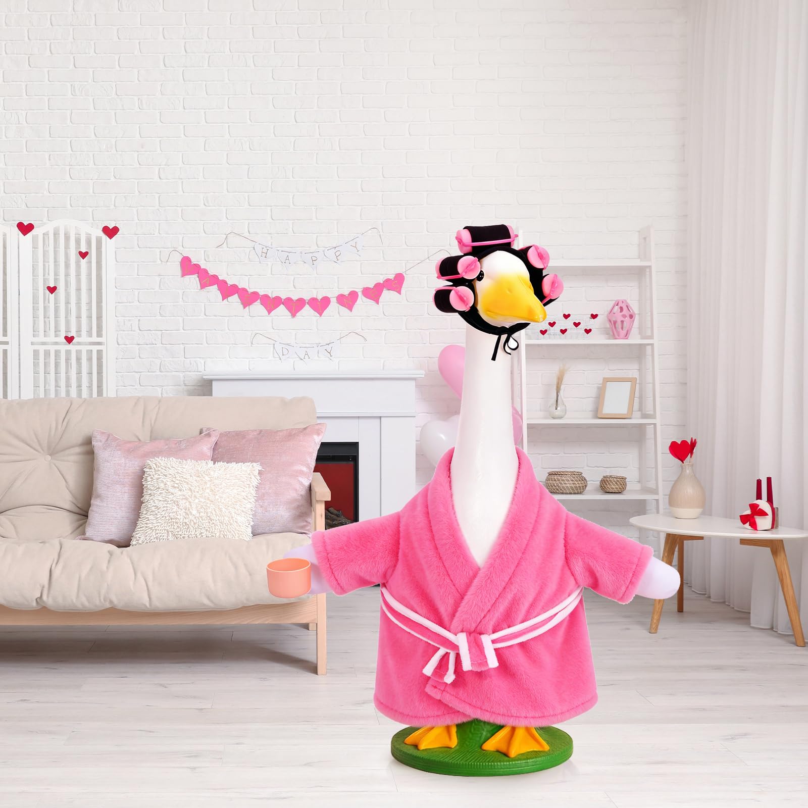JcHrmers pink bathrobe goose outfit adds playful holiday charm.