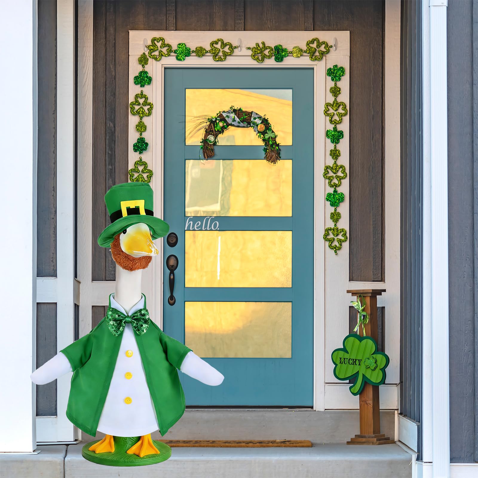 JcHrmers porch decoration shows festive green accents on a lawn goose