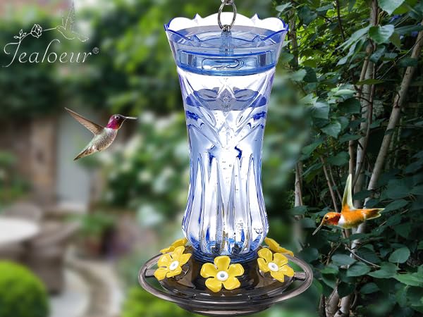 Bright blue Jealoeur feeder adds a vivid accent to garden decor.