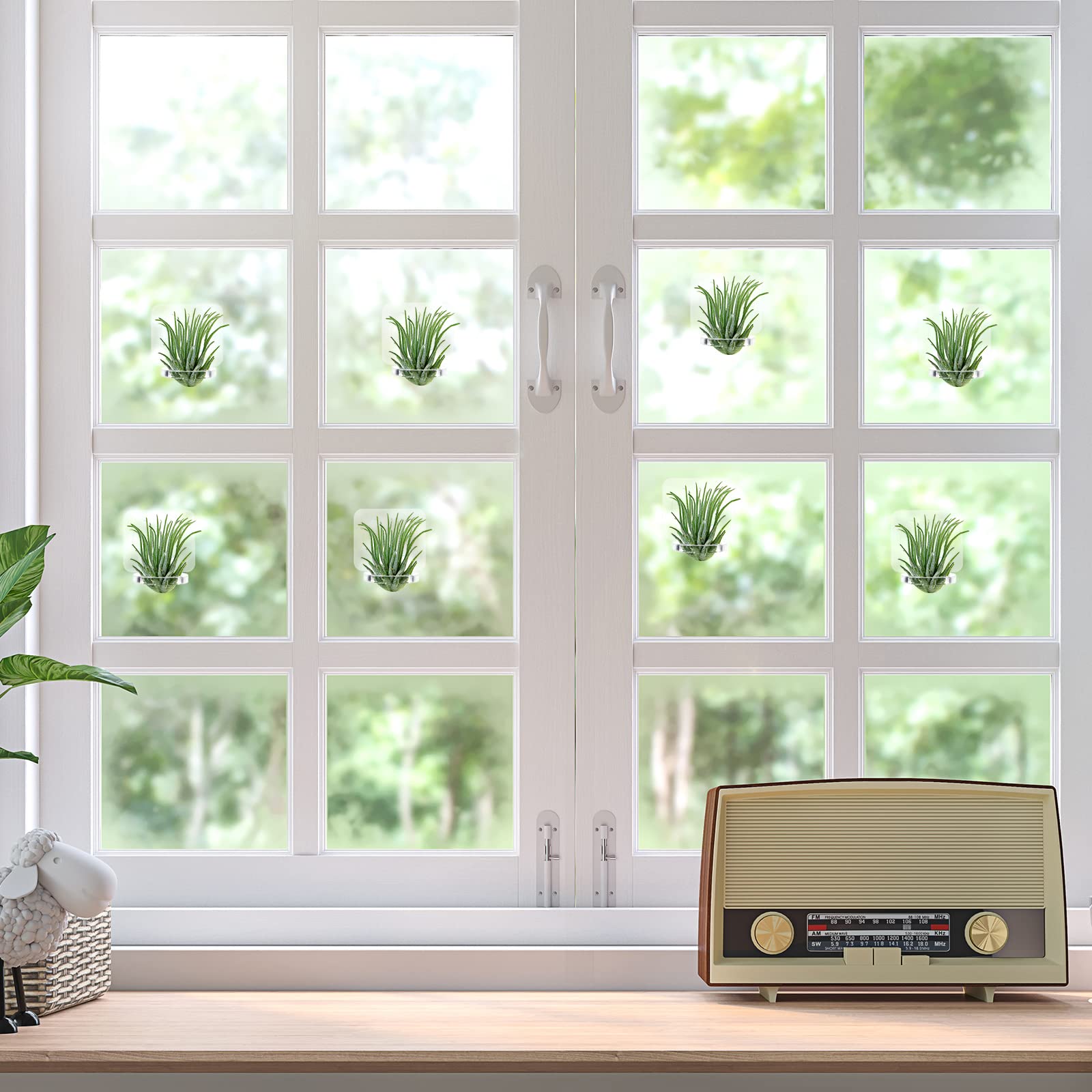 Jetec glass-display arrangement using clear hangers for floating greenery.
