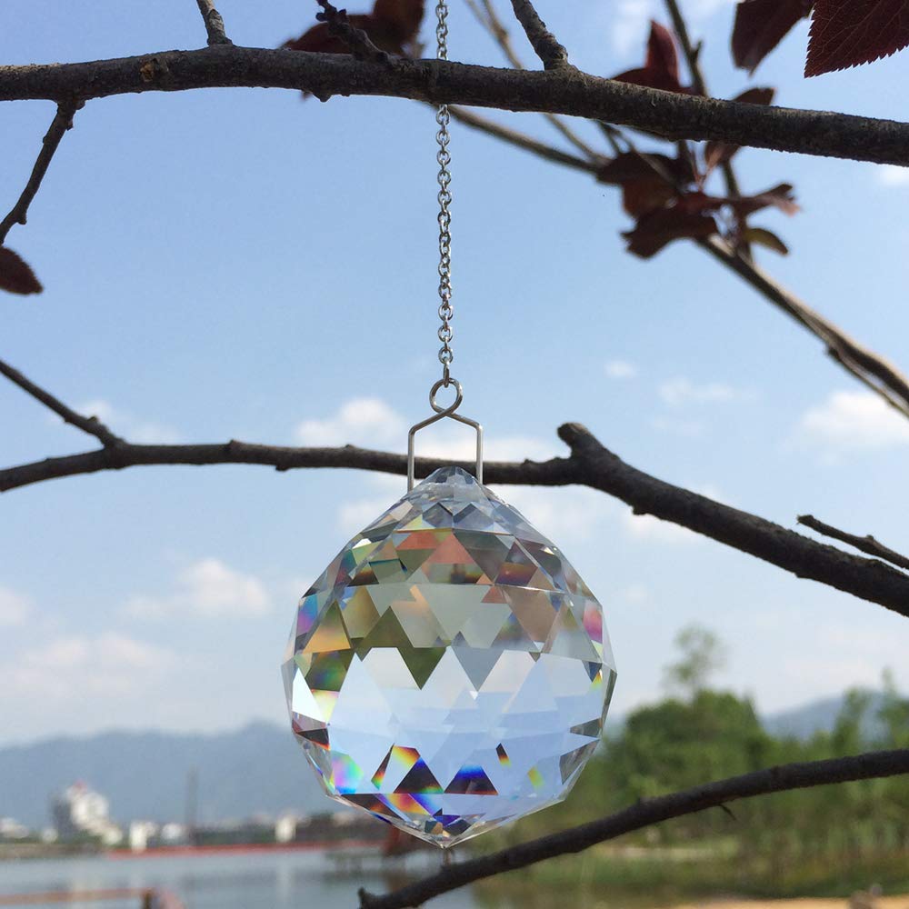 JIHUI prism ball by window adds rainbow reflections to the room.