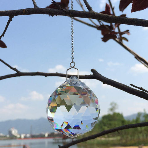 JIHUI prism ball by window adds rainbow reflections to the room.