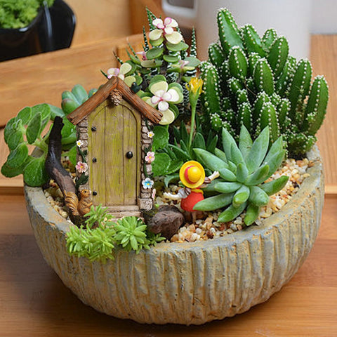 Jiumo weatherproof resin fairy door provides durable garden charm year-round.