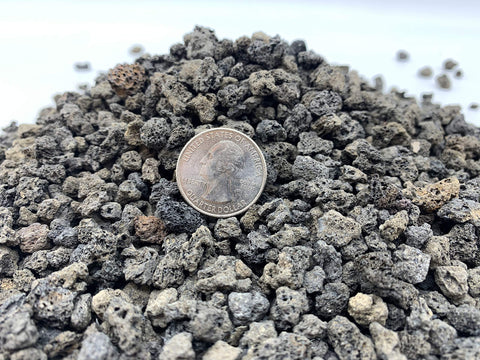 Close-up of JK Global Imports lava rock with quarter-inch particles for soil drainage