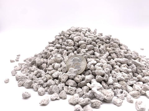 JK Global Imports pumice being poured into a soil mix for aeration