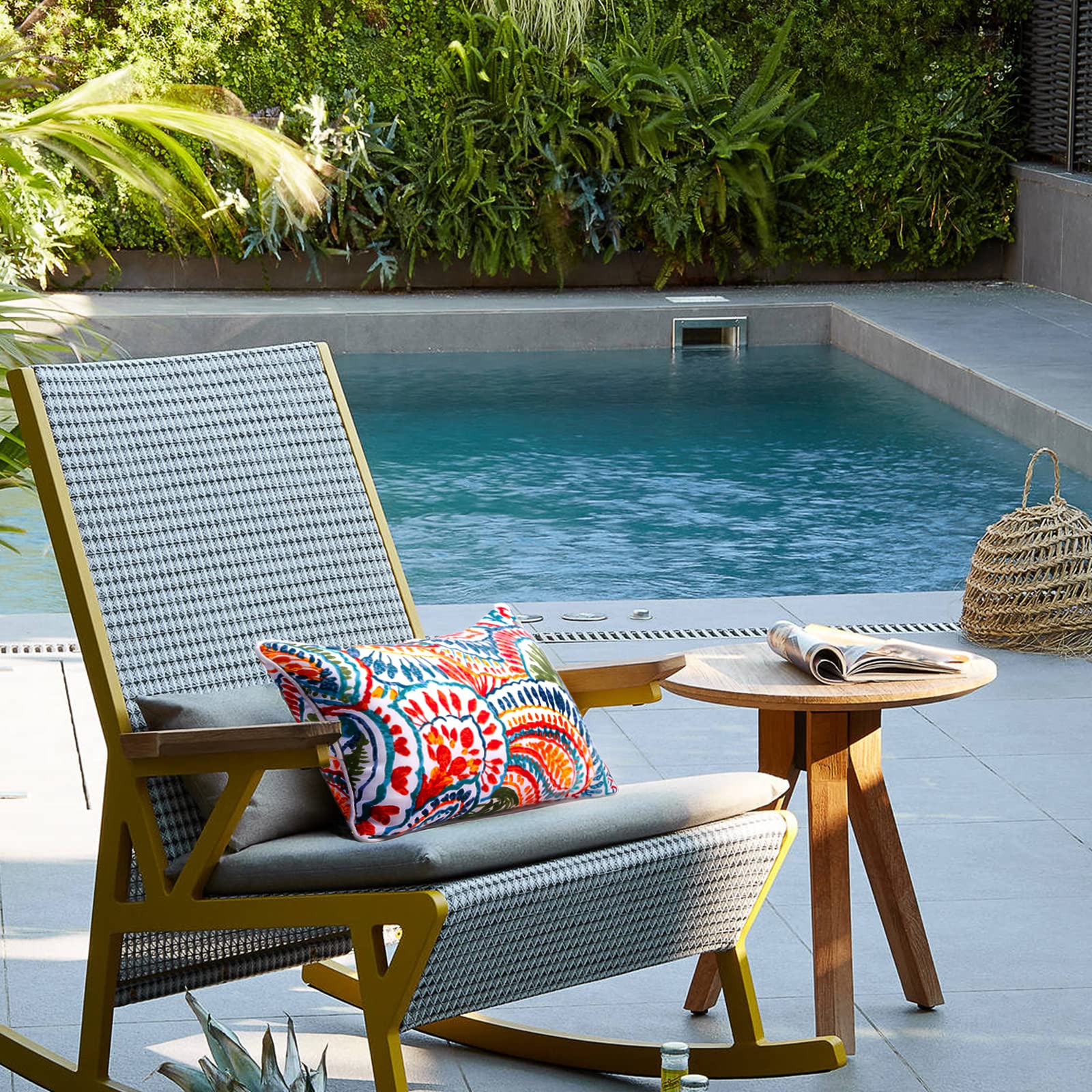 JMGBird paisley-pattern outdoor pillow enhances garden seating with color