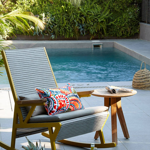 JMGBird paisley-pattern outdoor pillow enhances garden seating with color