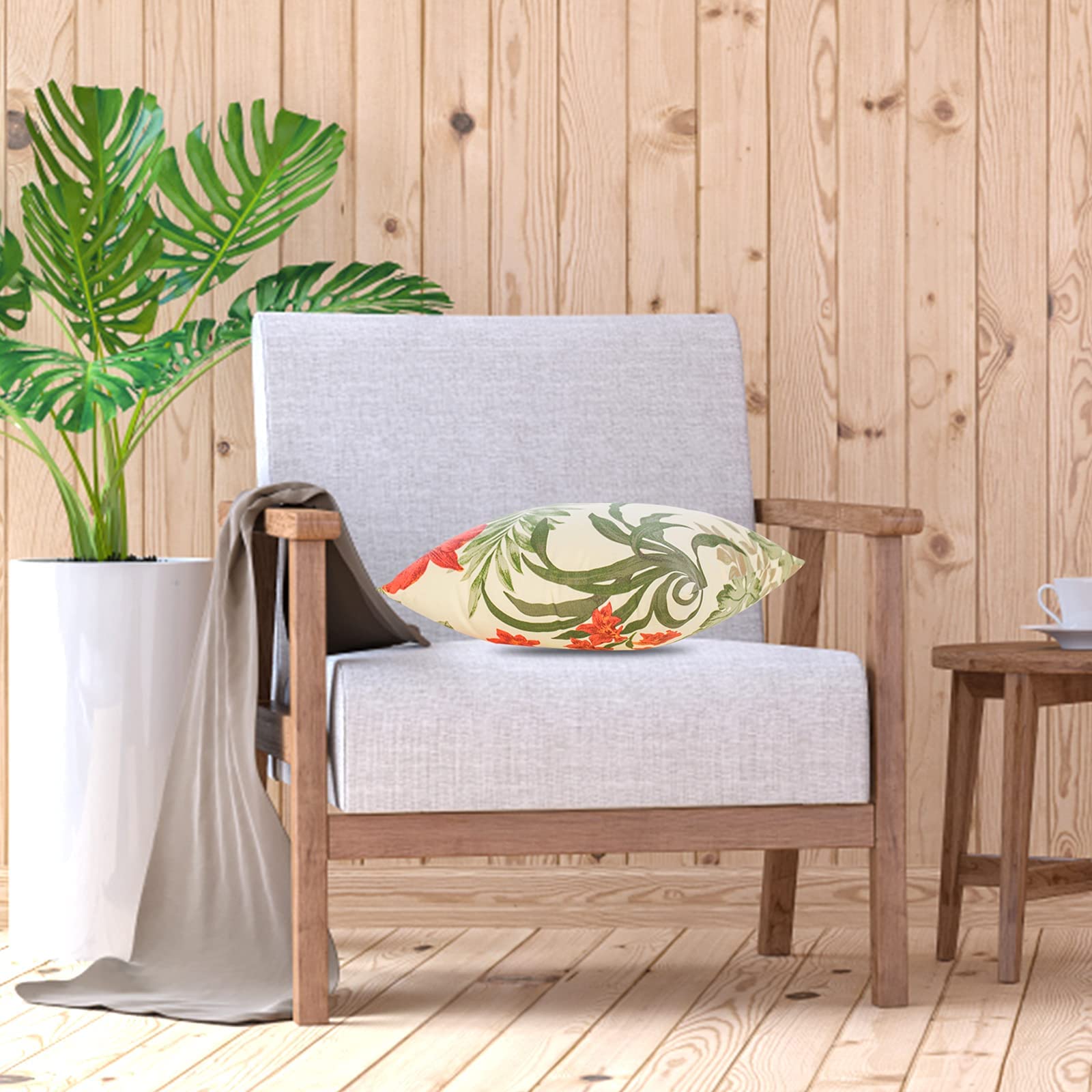 JMGBird patio cushions brighten outdoor seating with cheerful red and yellow motif.