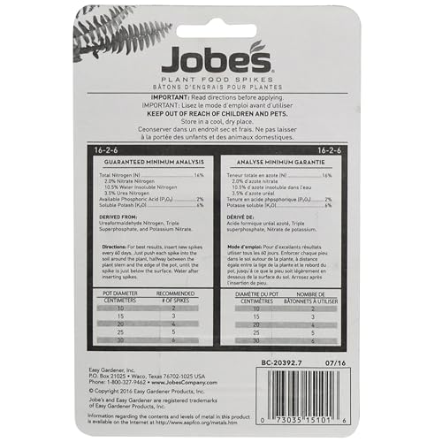 Jobe's spikes in soil around roots for steady plant nutrition.