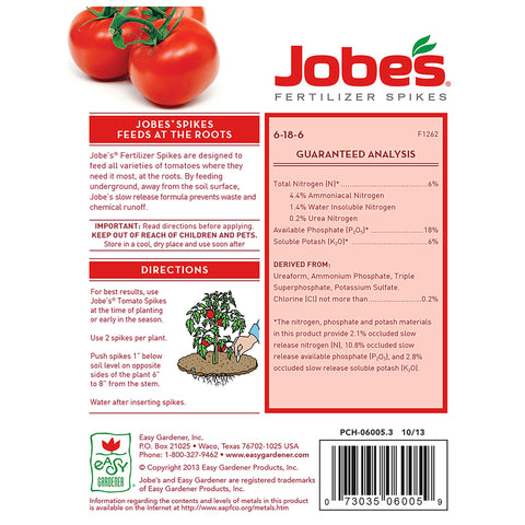 Jobe's Organics spikes around a tomato plant providing slow-release feeding
