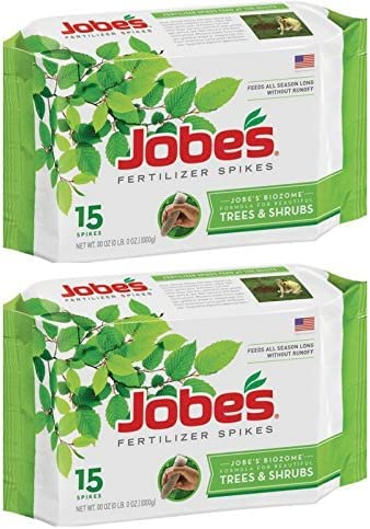 Jobe's Organics Tree & Shrub Fertilizer Spikes close-up, designed to feed roots gradually for healthier trees.