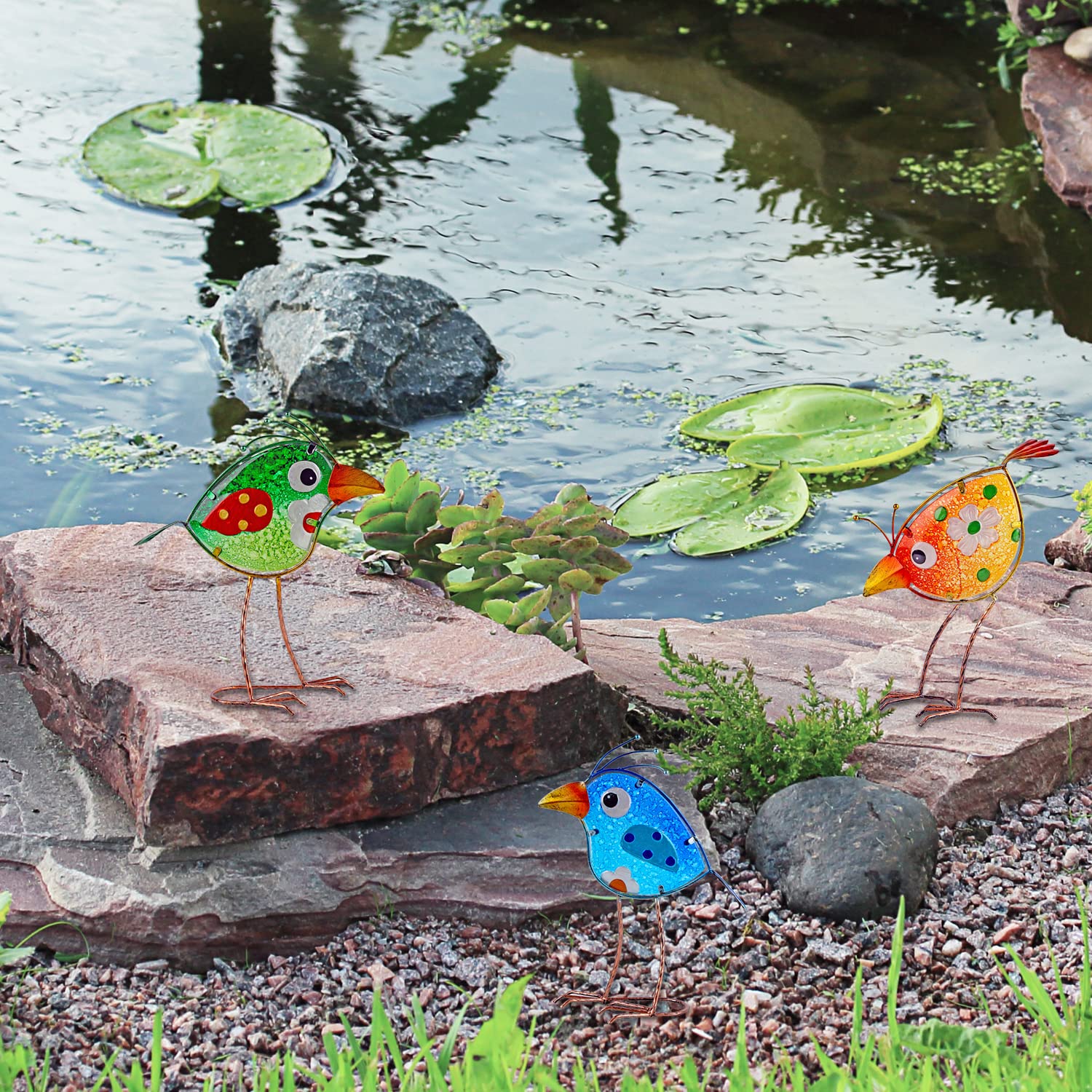 John's Studio hand-painted birds with glass accents bring life to exteriors.