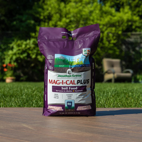 Dry MAG-I-CAL Plus granules on soil ready for application.