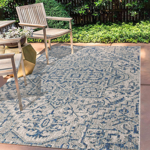 Jonathan Y boho medallion rug patio porch image emphasizes easy care in busy areas.