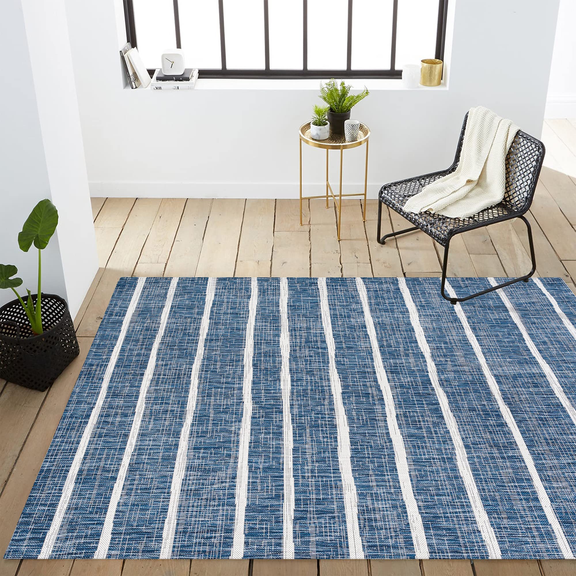Jonathan Y Berber Stripe Rug blends coastal blue and ivory tones
