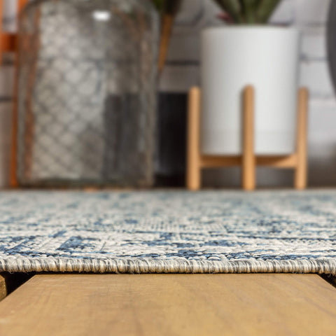 Jonathan Y navy gray rug colorway adds warmth to outdoor seating areas.