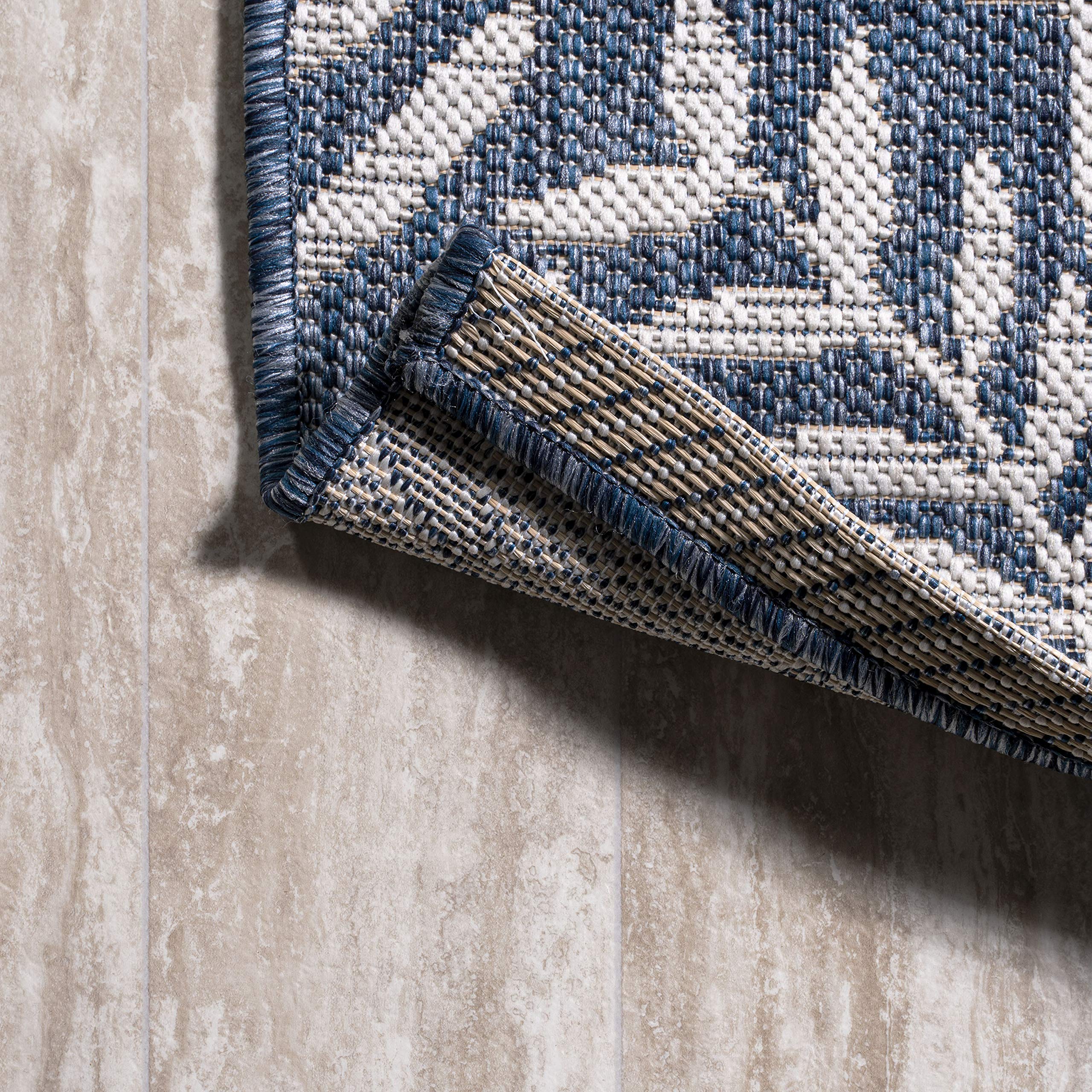 Jonathan Y navy-cream texture enhances outdoor spaces with graphic contrast.