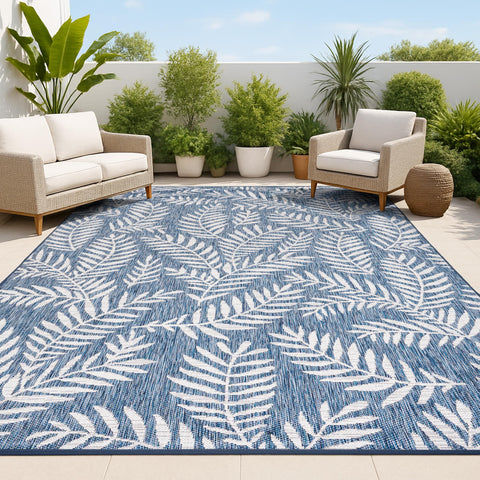 Jonathan Y palm frond rug in navy and ivory for patio ambiance and easy cleaning.