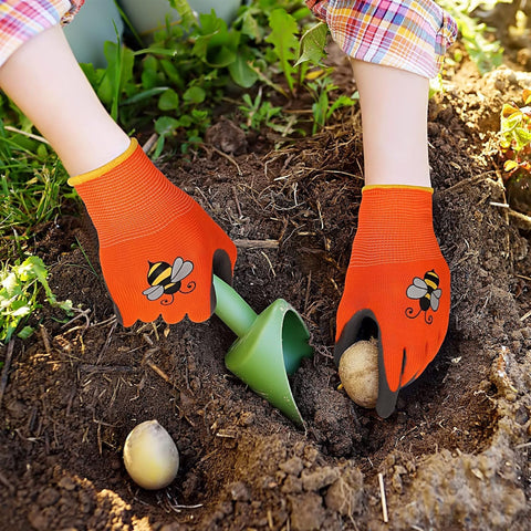 Joottuan kids gardening gloves in action during yard tasks.