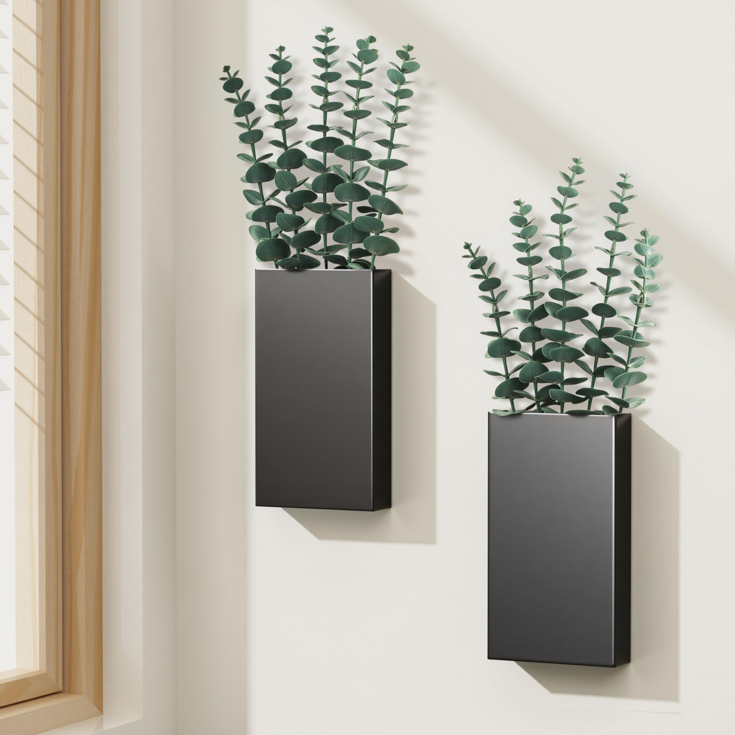 Josmimic two-pack wall planters with eucalyptus for indoor greenery and rustic charm.