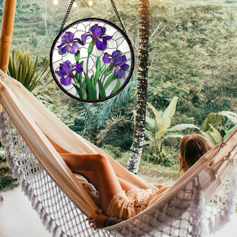 JOSUMALY purple iris stained glass window suncatcher hangs on a wall creating a sunlit focal point.