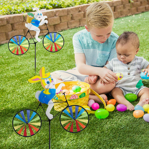 Jremreo garden display featuring the two pack bunny spinners in a lush lawn