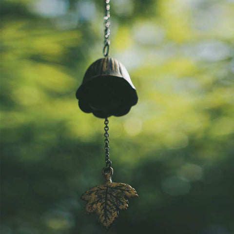 Jsacemxi balcony wind chime adds quiet focal point to outdoor seating.