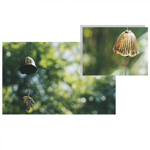 Jsacemxi cast-iron wind bell with bless temple motif for enduring outdoor charm.
