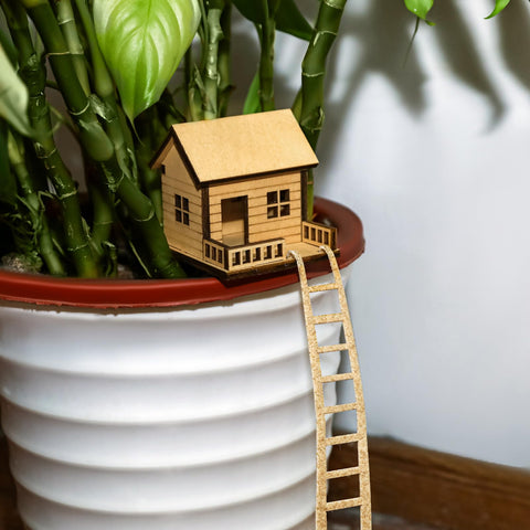JULEASEL Mini Treehouse in small pot highlights natural wood charm