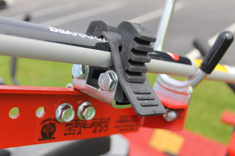 Heavy-duty clamp of Jungle Jim's ZTR-TR keeps trimmer secure while mowing