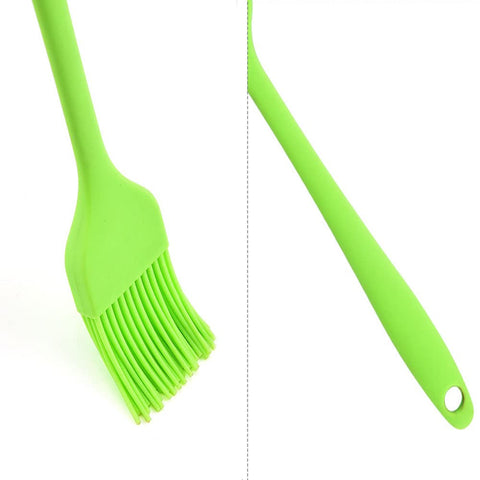 Pink silicone kitchen brush designed for easy dishwasher-cleanup