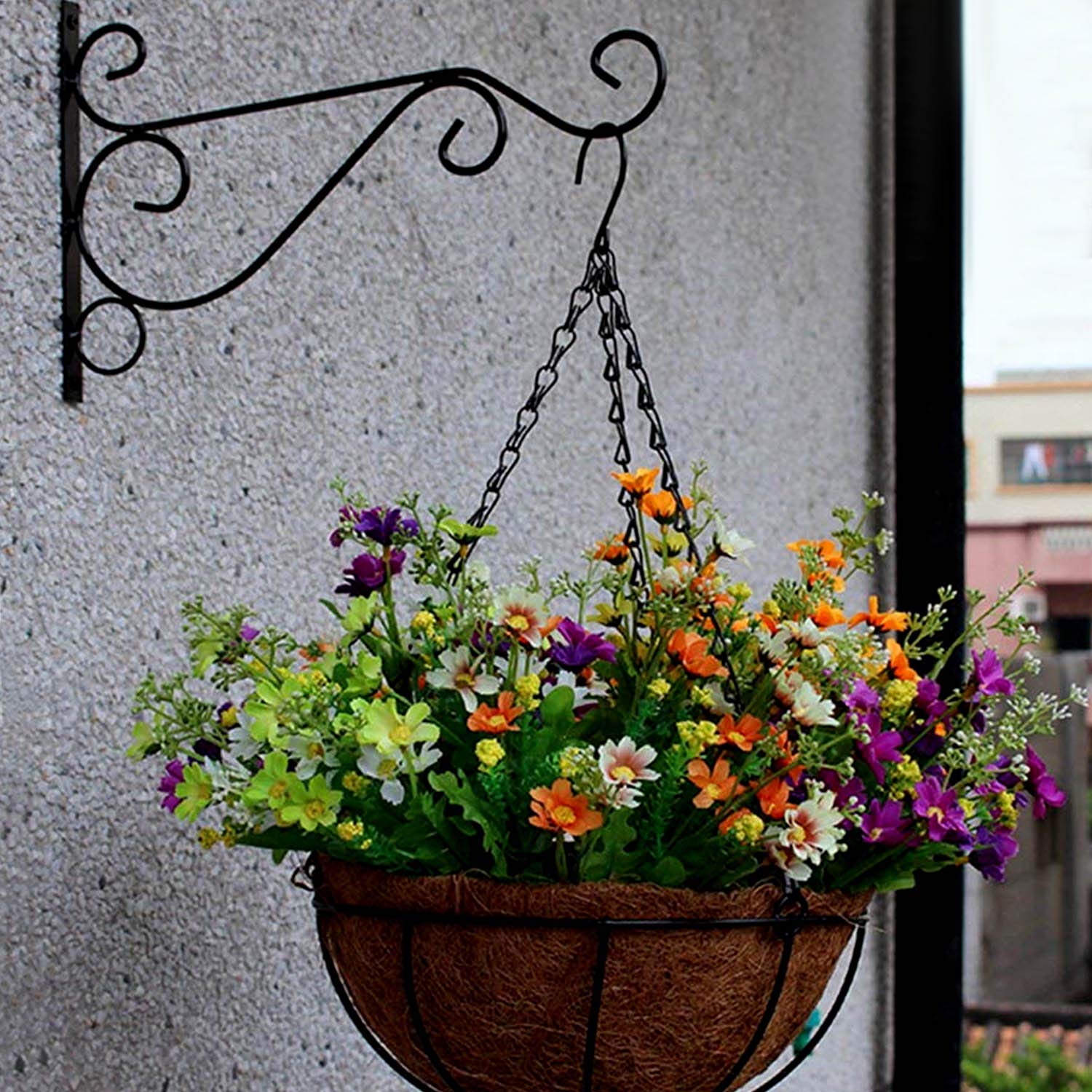 KABB garden setting with bird feeders and lanterns.