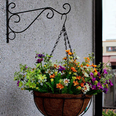 KABB garden setting with bird feeders and lanterns.