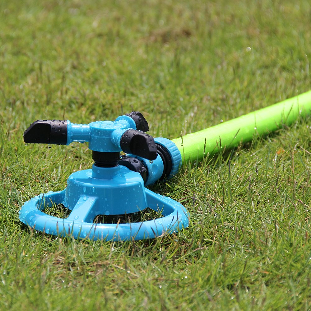Kadaon sprinkler installation on grass highlights plug-and-play convenience.