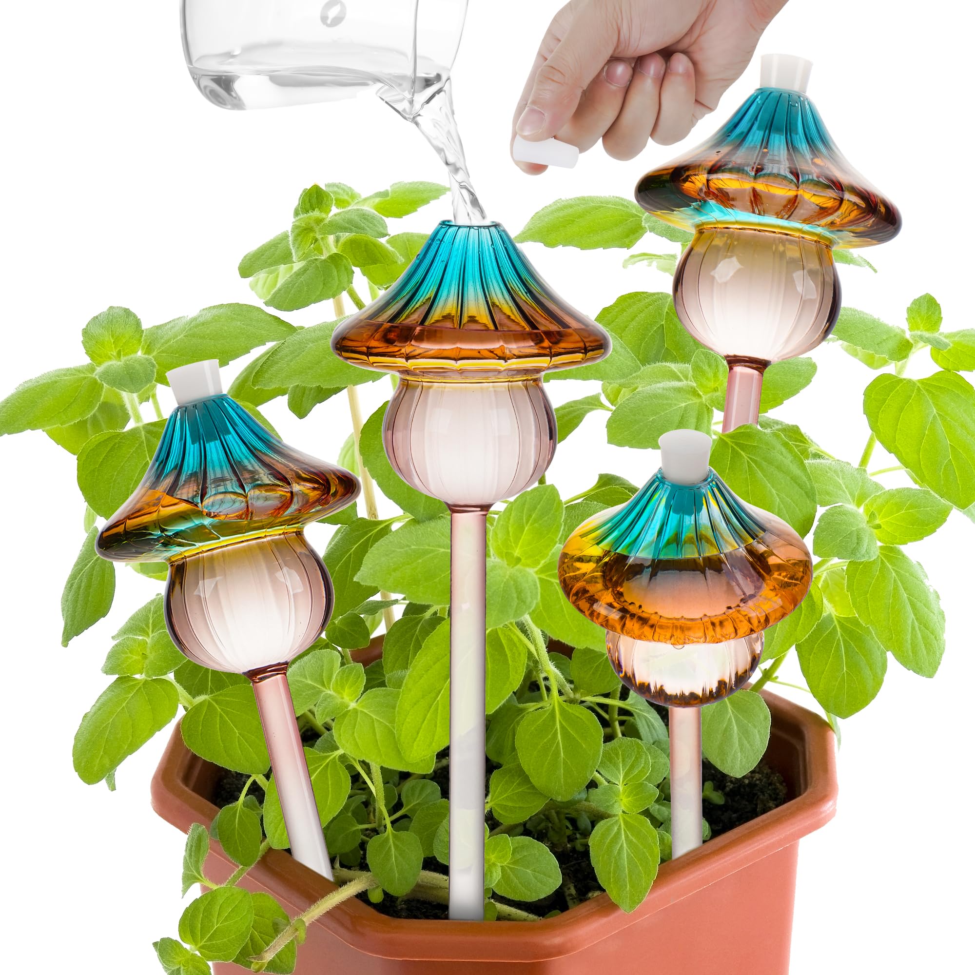 Kaimfdg mushroom globes in rainbow glass decorate plants while providing self-watering support.