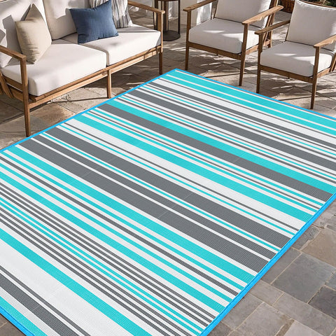 Kalafun outdoor rug blue-grey stripes enhances patio comfort and style.