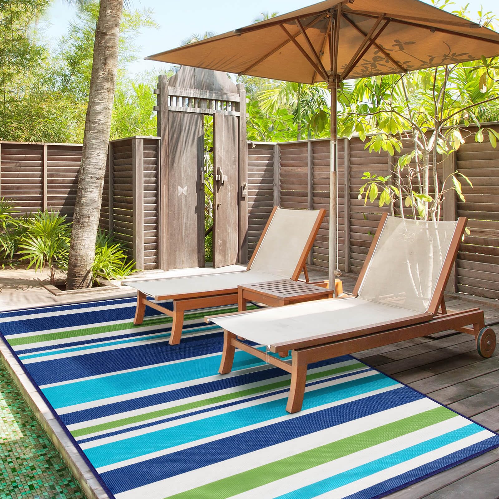 Kalafun outdoor rug folded for storage, blue-green, convenient for travel.