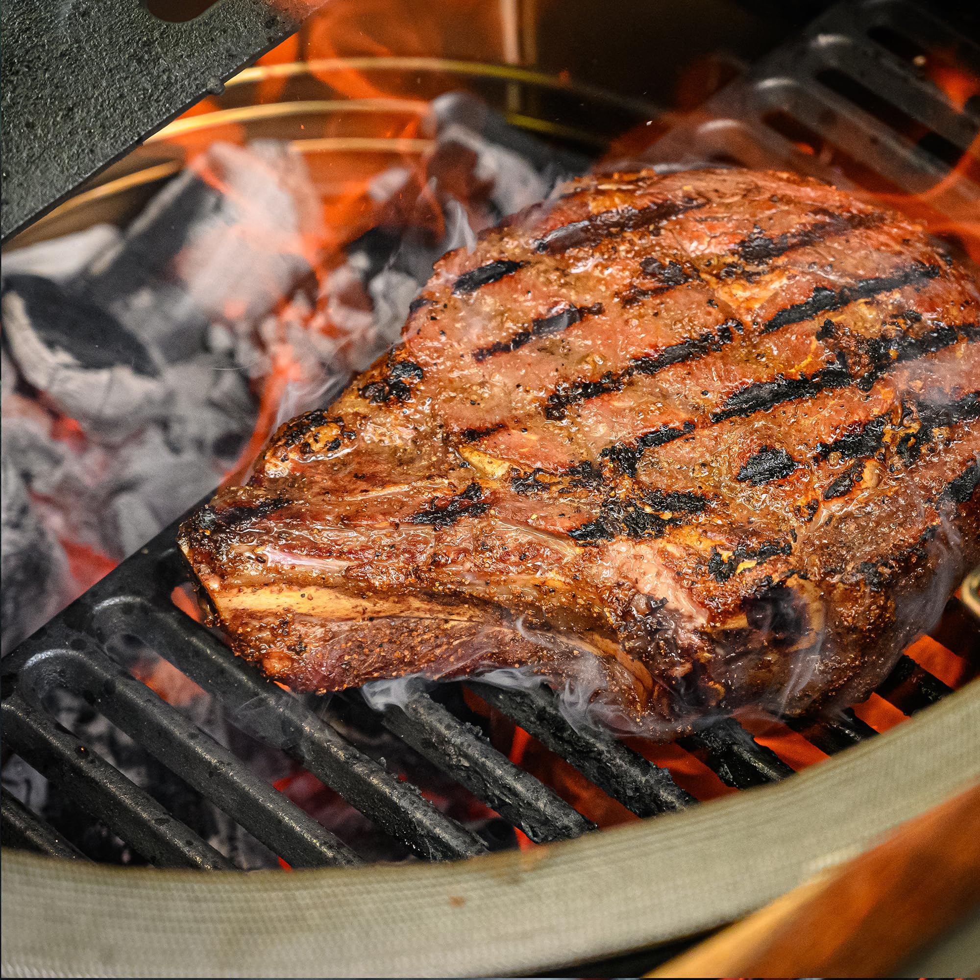 Kamado Joe cast-iron area retains heat for searing.