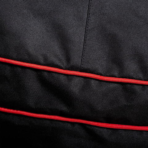 Waterproof polyester fabric of Kamado Joe cover shields against rain.