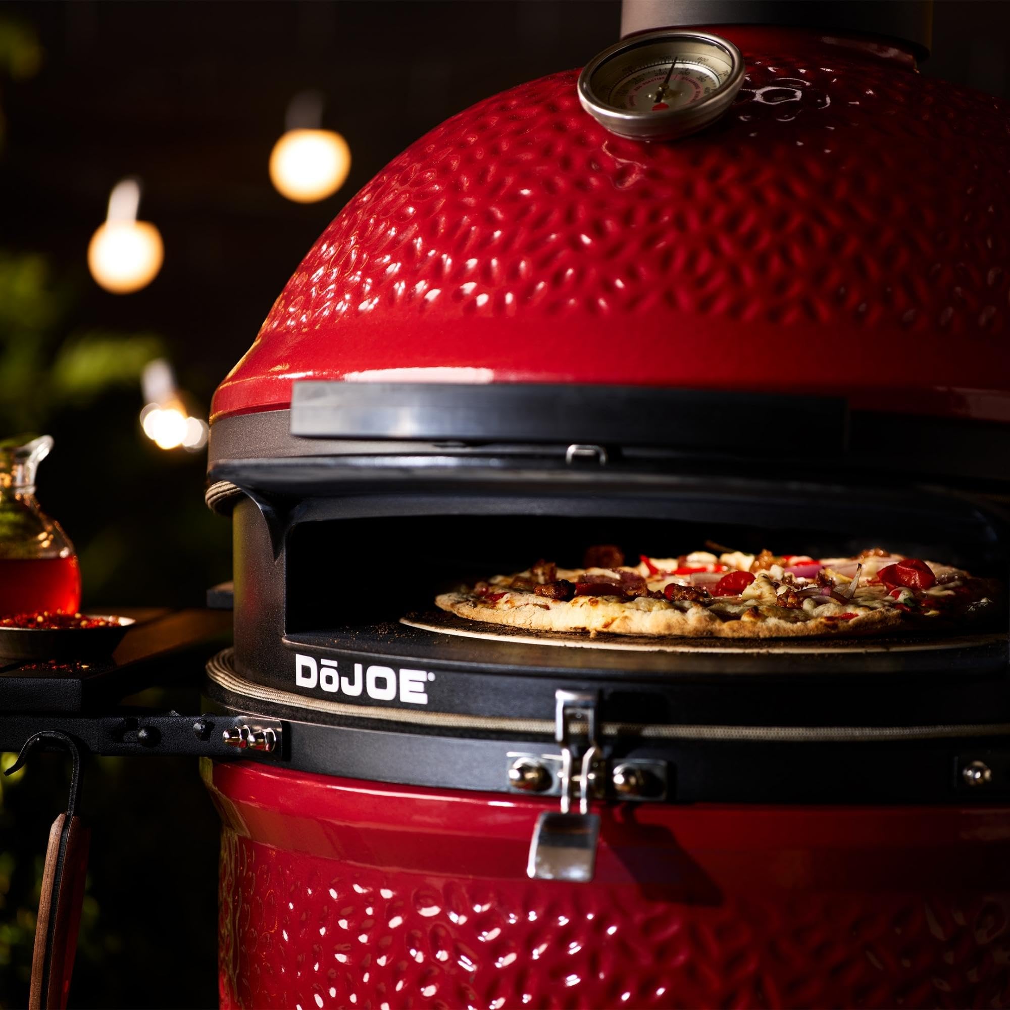 Kamado Joe DōJoe pizza stone in use for even cooking